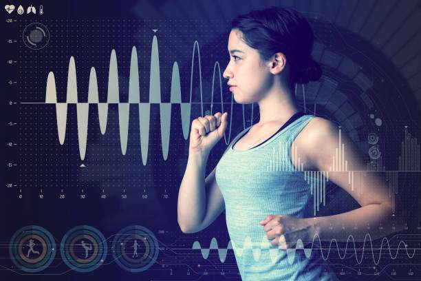 Woman monitoring fitness data on screen.